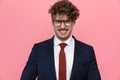 Enthusiastic young businessman in suit wearing glasses