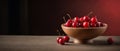 Red cherries in a wooden bowl. Fresh fruits on the table with dark red background.