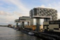 The entire riverside of the Rhine river is lined with new modern buildings in Cologne, Germany.