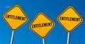 Entitlement - yellow signs with blue sky Royalty Free Stock Photo