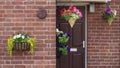 House door with hanging flower baskets