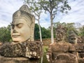 At the entrance of Angkor Thom statues on the bridge Royalty Free Stock Photo