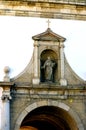 Entrance arch through the surrounding wall into Faro old town Royalty Free Stock Photo