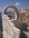 Entrance with an arched window leading to the territory of the monastery Akrotiri. Santorini, Greece. Royalty Free Stock Photo