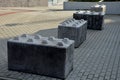 entrance barrier made of a block of concrete in the shape of a