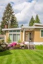 Entrance of beautiful family house with green striped lawn in front Royalty Free Stock Photo