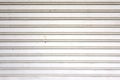 closeup old white metal roller shutter door, horizontal lines abstract background Royalty Free Stock Photo