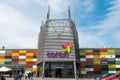 Entrance of Coresi mall , business logos, colorful glass