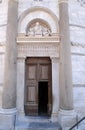 Entrance door of the Leaning Tower of Cathedral in Pisa Royalty Free Stock Photo