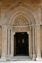 the entrance door of the Saint-Hilaire Collegiate Church in Semur-en-Brionnais