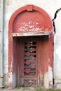 Entrance door to an old damaged building