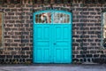 Entrance door to an old steel mill, building made of cinder stone Royalty Free Stock Photo