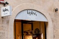 The entrance door to the outlet of the Kipling company with a Live Light slogan which sells bag and other luxurious accessories