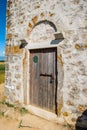 Entrance door of very old catholic church of St. Nicolas in Nin in Croatia near Zadar Royalty Free Stock Photo