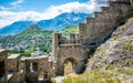 Entrance door and wall of the ruins of Tourbillon castle and Sion hill and city panorama in background Sion Valais Switzerland Royalty Free Stock Photo