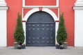 Entrance doors of historical building with potted plants