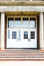 Entrance doors to a typical American school building with steps