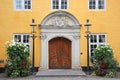 Entrance doorway of the Old City Hall. Beautiful historic yellow painted building in the city centre, Aalborg, Denmark Royalty Free Stock Photo