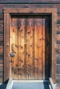 Entrance dorr and wall made of edged wood material