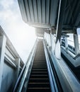 Entrance of escalator at subway station with sunlight. Future concepts. Royalty Free Stock Photo