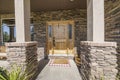 Entrance exterior of a house with stone veneer siding Royalty Free Stock Photo