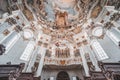 Feb 1, 2020 - Steingaden,Germany: Entrance facade with organ piple and ceiling fresco inpilgrimage church of Wies Royalty Free Stock Photo