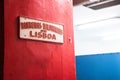 Entrance of fire station Bombeiros VoluntÃÂ¡rios de Lisboa. Detail of red sign of