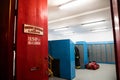 Entrance of fire station VoluntÃÂ¡rios de Lisboa with firefighter uniforms and lockers on a