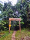 Entrance of forest trail. Woodland footpath through natural rainforest. Entrance gate to the jungle at Fraser\'s Hill