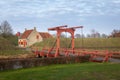 Entrance of fortress with historic red bridge over water ancient house museum town