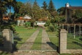 Entrance with garden and iron gate in a house Royalty Free Stock Photo