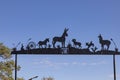 entrance gate with animal symbols at an animal rescue farm in Blanco, Texas