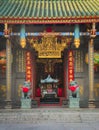 Entrance gate of a chinese buddhist temple in Saigon, Vietnam. The door is guarded by two Imperial lions made of stone. Royalty Free Stock Photo