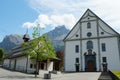 An entrance gate, facade or door of Engelberg Abbey, Benedictine monastery and the St. Jacob chapel in spring time