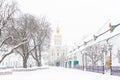 Entrance gate of the Pechersk Lavra in Kiev, Ukraine. The Gate Church of the Trinity in winter snow