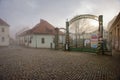 The entrance gate to the old brewery and malting plant on a foggy winter day. Znojmo, Czech Republic Royalty Free Stock Photo