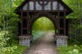 Entrance gateway on an empty path through a forest. 3D illustration