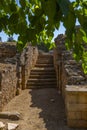 Entrance of granite stairs of the ruins of the architectural complex of the Amphitheater and Roman Theater of Merida on a sunny Royalty Free Stock Photo