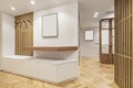 Entrance hall of a modern home with minimalist contemporary design wooden furniture and herringbone oak parquet floors