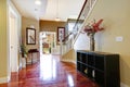 Entrance hallway with cabinet and decorative flowers