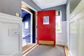 Entrance hallway with open red door