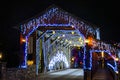 Entrance Of Herr's Mill Covered Bridge Adorned With Twinkling Blue And White Christmas Lights Royalty Free Stock Photo