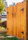 Entrance of house with beautiful new wooden gates. Gateway Background. Traditional wooden closed door gates