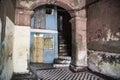 Entrance of ruinous house, remains of colonial styled house in Santiago de Cuba, Cuba