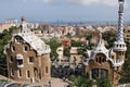 Entrance lodge to Parc Guell designed by Antoni Gaudi, UNESCO, with a skyline view of the city of Barcelona, Catalonia, Spain