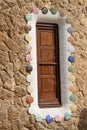 Entrance lodge to Parc Guell designed by Antoni Gaudi, UNESCO, with a skyline view of the city of Barcelona, Catalonia, Spain