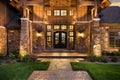 Entrance of a luxury home at twilight.