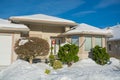 Entrance of luxury house with front yard in snow Royalty Free Stock Photo