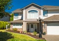 Entrance of luxury house with grass lawn in front Royalty Free Stock Photo