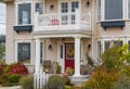 Entrance of a luxury house with a patio and beautiful landscaping on a sunny day. Home exterior Royalty Free Stock Photo